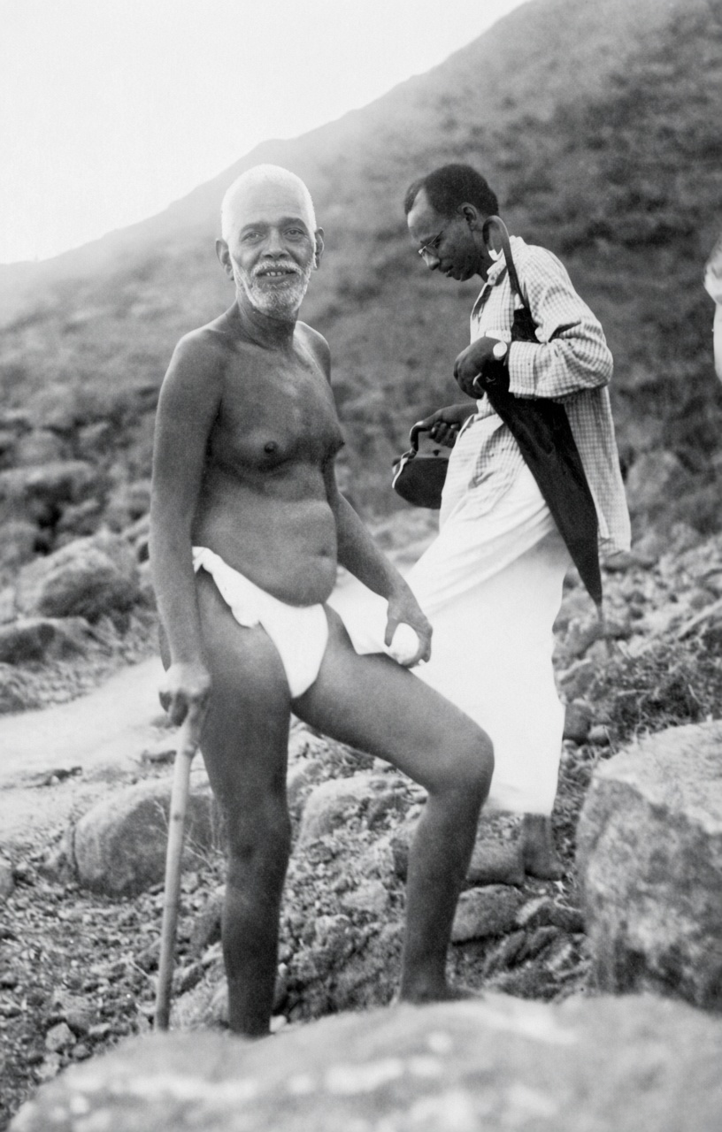 Bhagavan Sri Ramana Maharshi with a devotee on the slopes of Arunachala